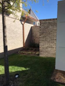 copper continuous rain gutters and down spouts back of house